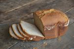 Gluten Free Bread Machine Recipes Side View of a Loaf of White Bread With a Few Slices Already Cut