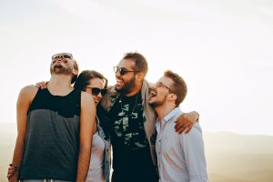 Quotes About Surrounding Yourself with Happiness a Group of Friends Embracing and Laughing