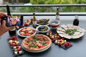 Casual Dinner Party Menu Ideas Food on a Table with a Person Taking a Pic of it